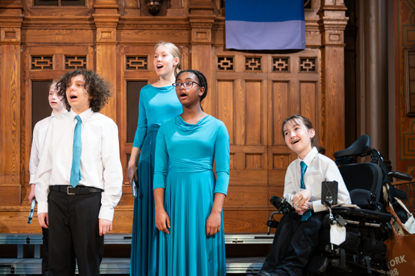 four teenagers singing